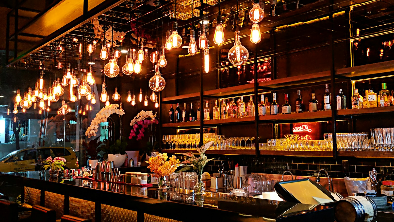 Warmly lit intimate restaurant bar, ideal setting for date night dining in Leicester